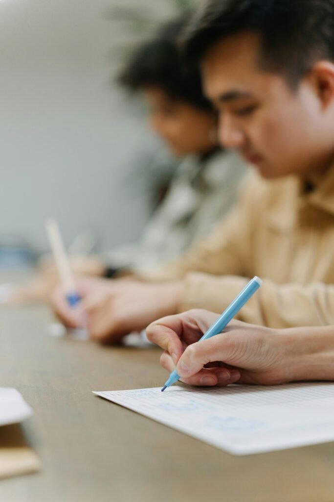 Close-up of unrecognizable group working during a strategic business meeting.